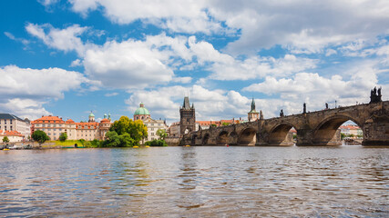 Charles Bridge monumental arcades, Old Town Tower bridge and beautiful Prague riverfront