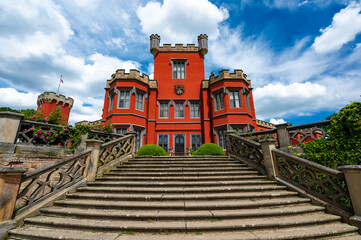 Romantic castle with red facade. Hradek u Nechanic. Czech Republic. Nechanice. Panoramic exterior...