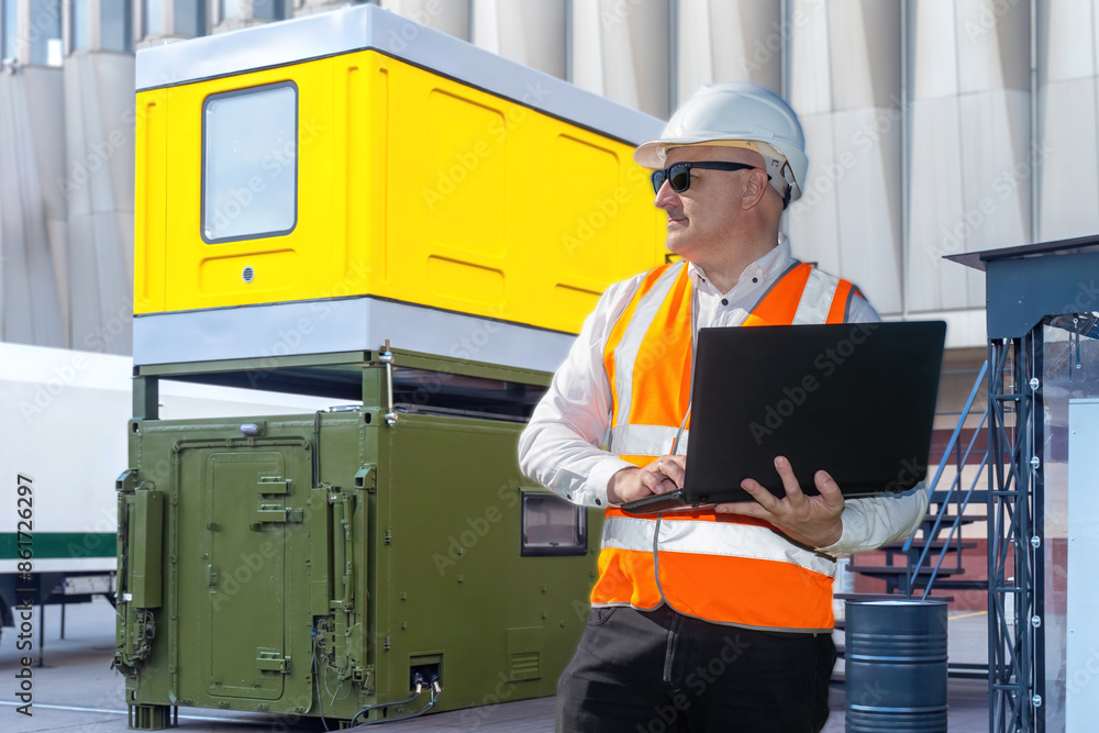 Aufkleber man industrialist. worker with laptop in his hands. factory builder in service uniform. architect ne