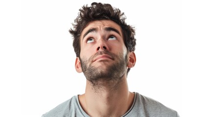 Obraz premium A man with a beard and a serious look on his face. He is looking up at something