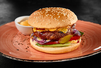 Delicious Beef Patty Burger with Fresh Toppings and Sesame Seed Bun