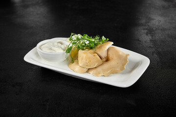 Salted Mushrooms with Sour Cream: Traditional Russian Cuisine on White Plate