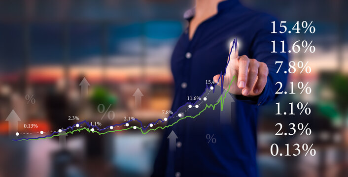 economics concepts: Executive analyzes business growth charts. points finger