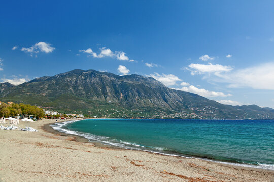 The sandy shore of Kalamata town in southern Greece (Peloponnese region) with the majestic Mount Taygetus in the background.