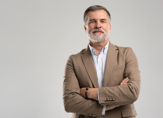 Entrepreneur in jacket smiling, Happy mid adult, mature age man standing, smiling, isolated on white background