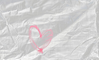 red transparent plastic film overlay texture background with a heart