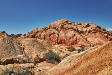 Picturesque Skazka Canyon on the southern shore of Issyk-Kul lake, Kyrgyzstan. Travel destination,...