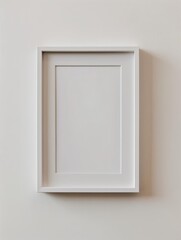 An empty, thin grey vertical 2x3 frame on a clean wall