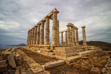 The ancient ruin of Poseidon, Cape of Sounion with cloudy weather near Athens, Greece.