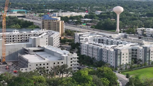 Explore the bustling business district of Altamonte Springs, Florida, with this stunning aerial footage. Captured in high-definition, this video showcases the modern office buildings, well-planned inf