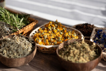 Bowls with dried flowers. Preparation for the practice of creating a mandala from flowers. 