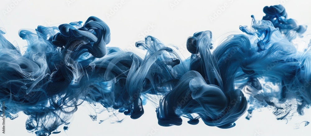 Poster blue and black ink swirling underwater, creating a colored abstract smoke explosion effect on a whit