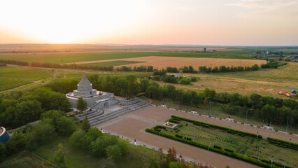 Naklejka premium Aerial view of The Mausoleum of Heroes of World War I from Marasesti, Romania. Photography was taken from a drone at a higher altitude at sunset with the building in the view.