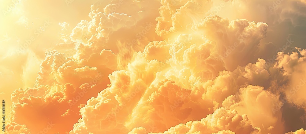 Poster the sunlight transforms the clouds into shades of orange and yellow, creating a serene and picturesq