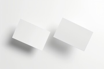 Floating Blank Business Cards Mockup for Graphic Designers, A mockup of two blank business cards floating in the air, with a white background and soft shadows.