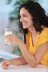 satisfied young woman drinking milk
