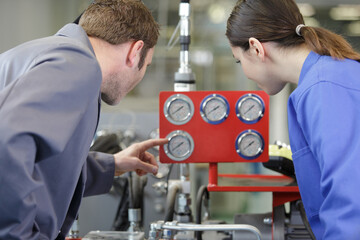 woman and man working with valves