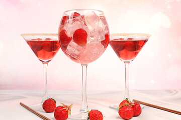 Fresh fruit cocktail or punch with strawberries and ice with fresh berries, summer party concept. Advertising banner or business card for bar and restaurant, holiday alcoholic drinks.