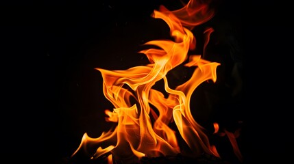 Fototapeta premium Blazing Fire Flames on Black Background. Abstract Inferno