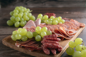 food, snack, meat, salami, plate, prosciutto, sausage, ham, gourmet, italian, rustic, board, cutting board, wooden, delicatessen, variation, photography