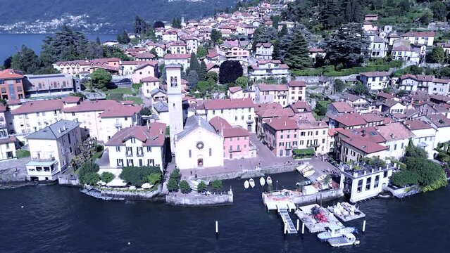cinematic aerial shot about a typical Italian town on Como lake called Torno famous for its gardens and little romantic streets
