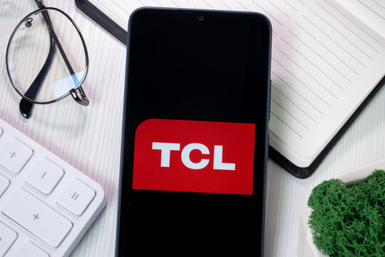 New York, USA - 21 June 2024: TCL Logo on Phone Screen, Company Icon