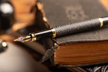 Fototapeta premium Fountain pen, beautiful details of an old fountain pen, selective focus.