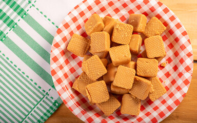Plate with milk dices for Festa Junina in Brazil, top view.