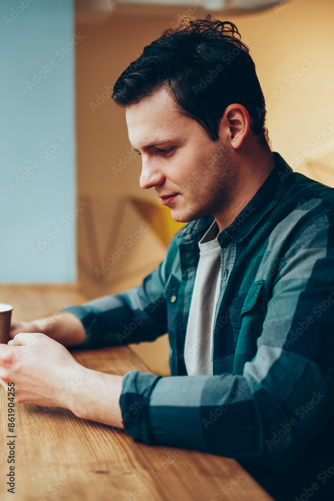Poster pensive teen hipster guy networking via smartphone on break adding new friend and chatting with foll