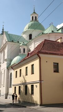 Grodno, Belarus. Famous Landmark Is St. Francis Xavier Cathedral At Summer Day. View From Karla Marksa Street