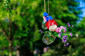 A bunch of flowers are hanging from a tree