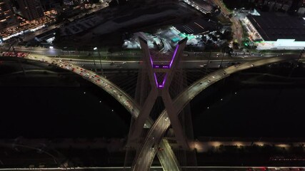 Aerial view of Octávio Frias de Oliveira Bridge, a landmark of São Paulo, and Marginal Pinheiros Avenue - São Paulo, Brazil - Powered by Adobe