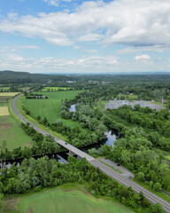 aerial view of esopus creek near kingston new york (electrical power station and bridge with road) farmland farming farm 