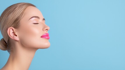 Fototapeta premium Woman with Pink Lipstick and Closed Eyes on Blue Background. Studio Portrait of Female with Smooth Skin and Elegant Makeup. Close-Up of Relaxed Woman's Face Highlighting Pink Lips. Ideal for Beauty an
