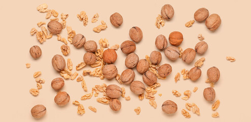 Natural walnuts on yellow background