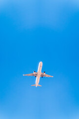 Airplane before landing in blue sky, Airbus A321-200