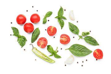 Fresh basil, cherry tomatoes and peppercorn on white background