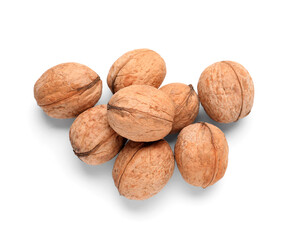 Heap of whole walnuts on white background