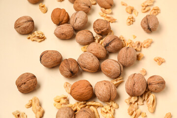 Natural walnuts on yellow background