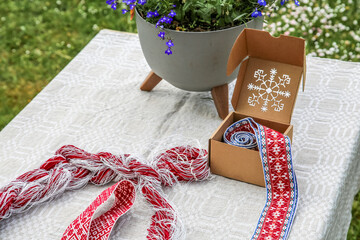 National symbols of Latvia is Lielvarde belt in traditional black and white colors