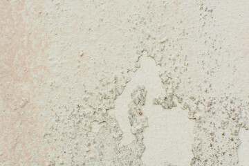Old peeling paint on walls, painted walls damaged from dampness and aging, textured old wall background