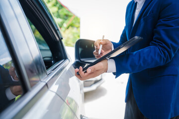 businessman in suit and car auto insurance agent assess car damage, discussing deductible, claims, coverage options comprehensive and collision insurance, completing necessary forms and appraisals.