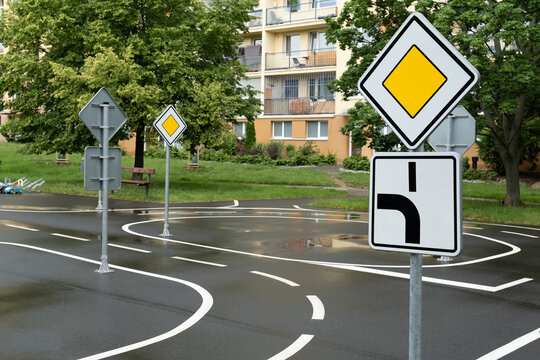 kid's playground designed as a mini road with signs, teaching transportation and traffic rules and safety through play. Located in Prague, Europe.
