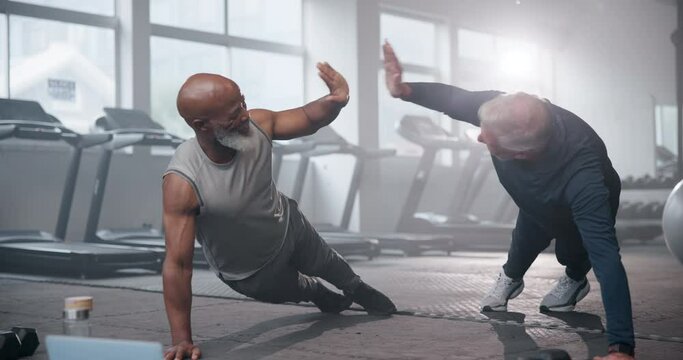 Friends, push ups and old men in gym, high five and exercise with personal trainer, wellness and warm up. People, pensioner or retirement with training, healthy and challenge with progress or fitness