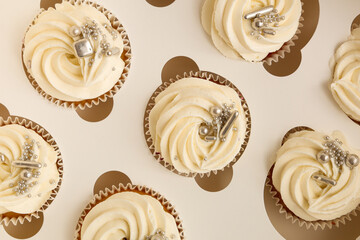 Delicious white cupcakes in box for birthday party, closeup