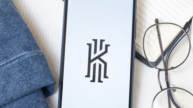 New York, USA - 21 June 2024: Kyrie Irving Logo on Phone Screen, Company Icon