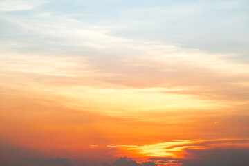 Obraz premium Beautiful , luxury soft gradient orange gold clouds and sunlight on the blue sky perfect for the background, take in everning,Twilight, Large size, high definition landscape photo