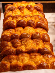 Traditional Jewish bread challah braided brioche bread in bakery