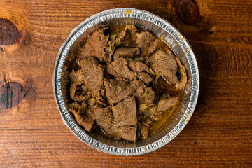 Stewed beef in a container