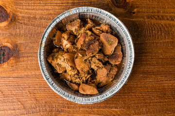 Stewed pork in a takeout container